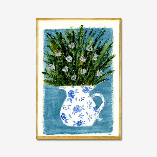 Framed artwork of a floral arrangement in a blue and white pitcher on a light blue background and a gold frame. Made with oil pastels.