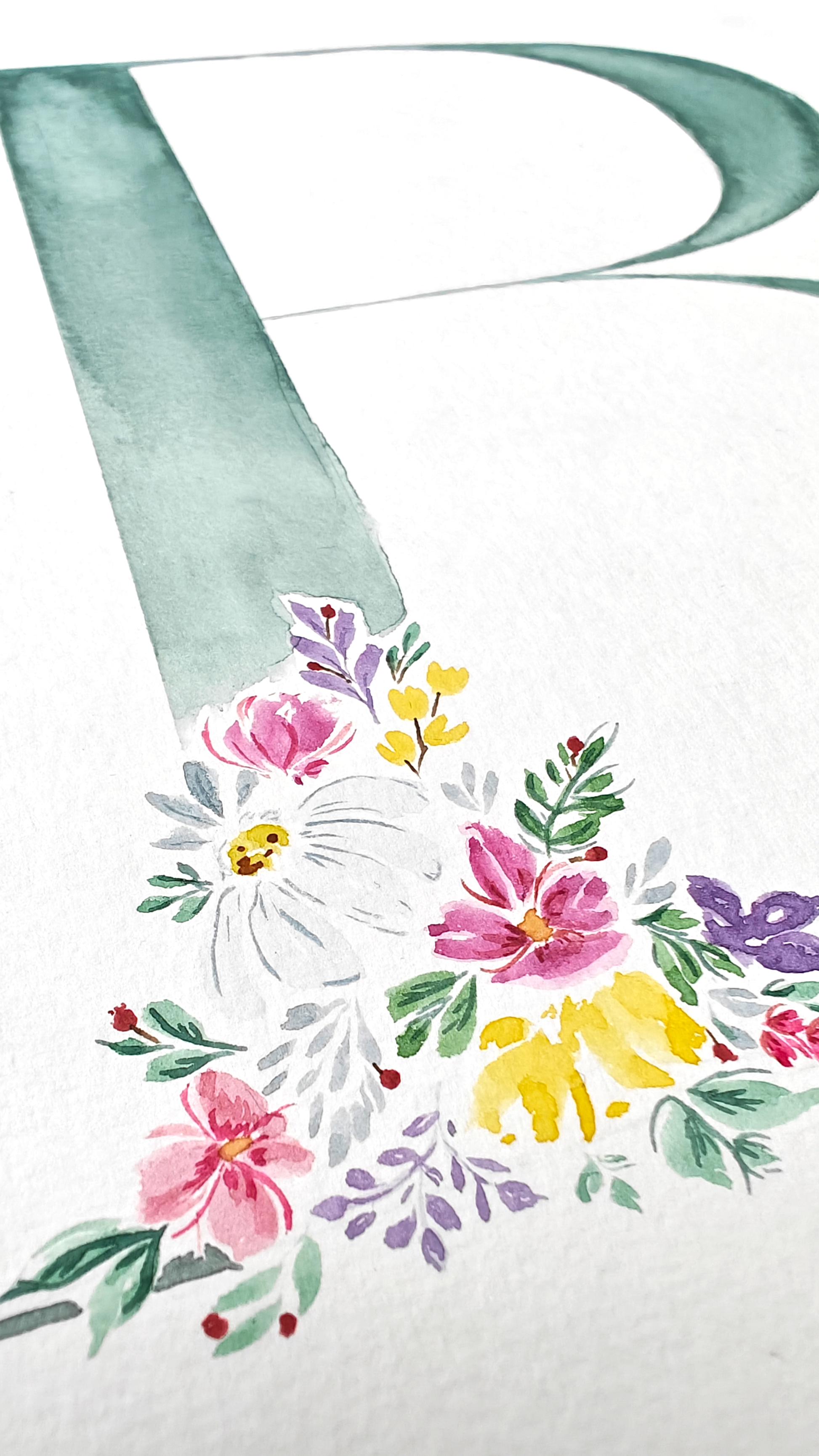 Closeup of letter 'B' with floral design on a white background. Made with watercolour.