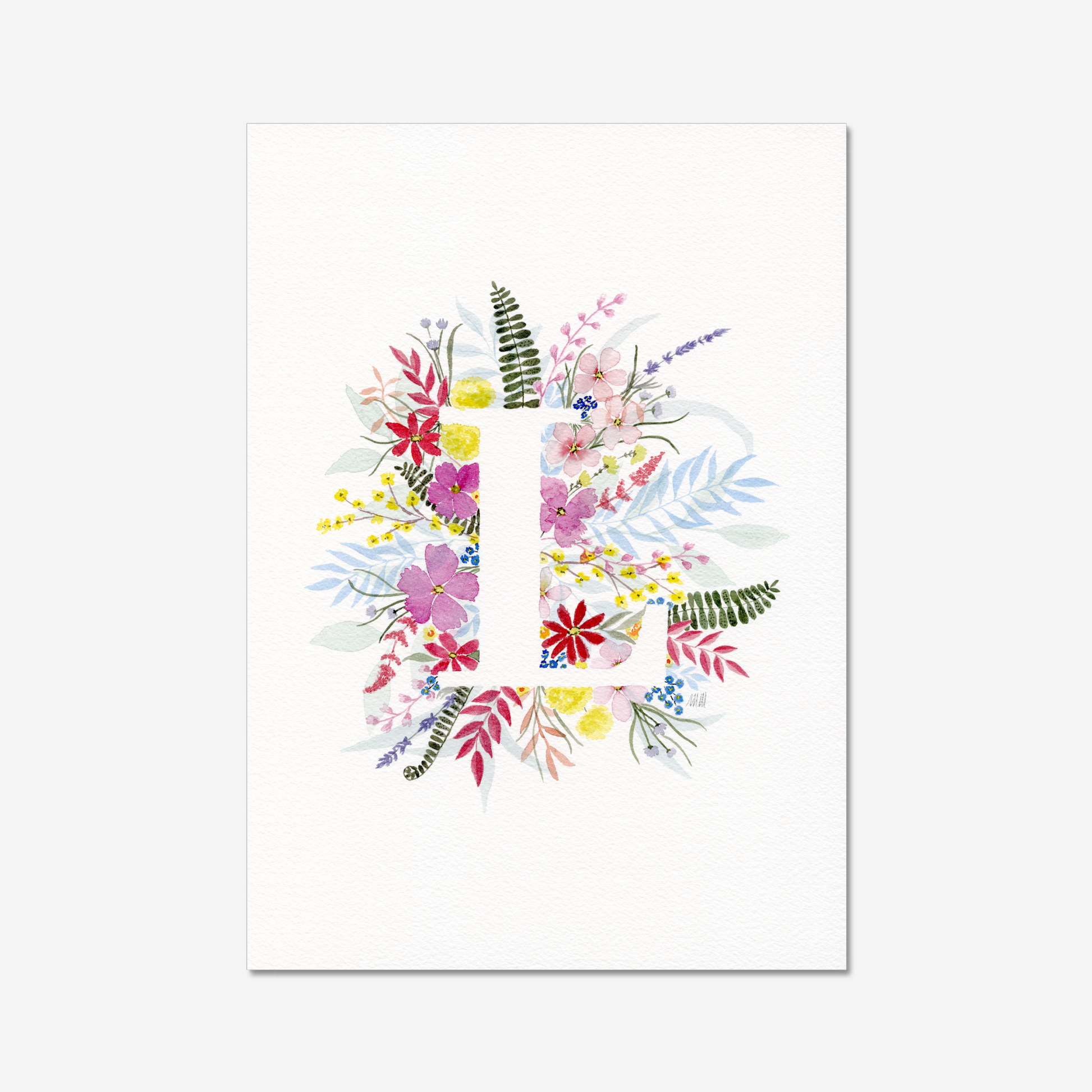 Colourful floral design on a white background with white letter L. Made with watercolours.