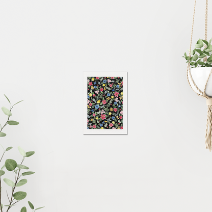 Floral pattern with colourful flowers on a black background. On white wall surrounded by plants. Made with watercolours. 
